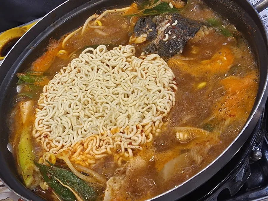 Spicy fish stew with added instant noodles