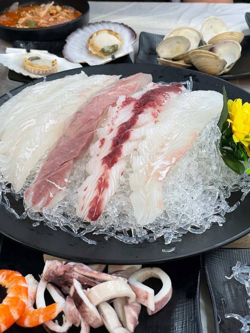 Table spread for the crab and sashimi A set