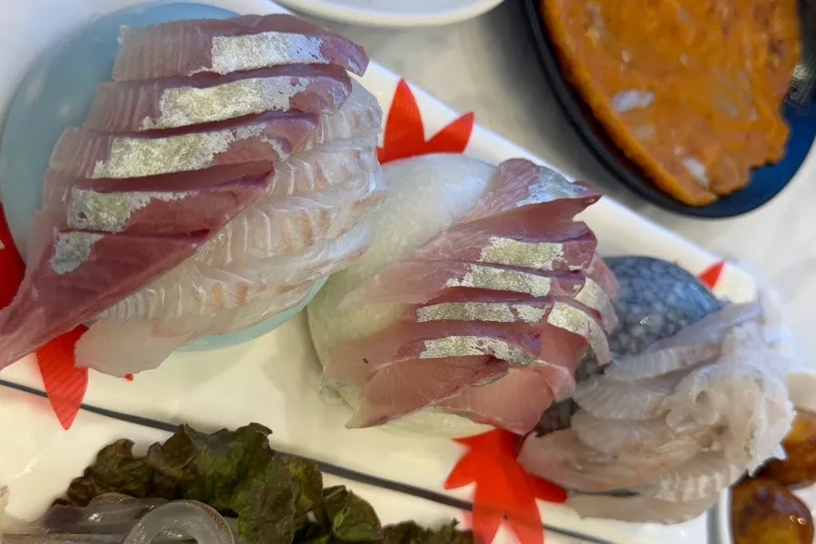 Raw fish sashimi plate included in the course