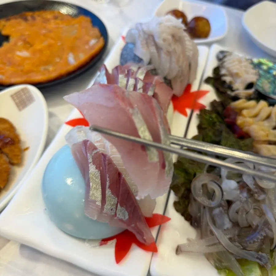 Close-up of a sliced piece of sashimi