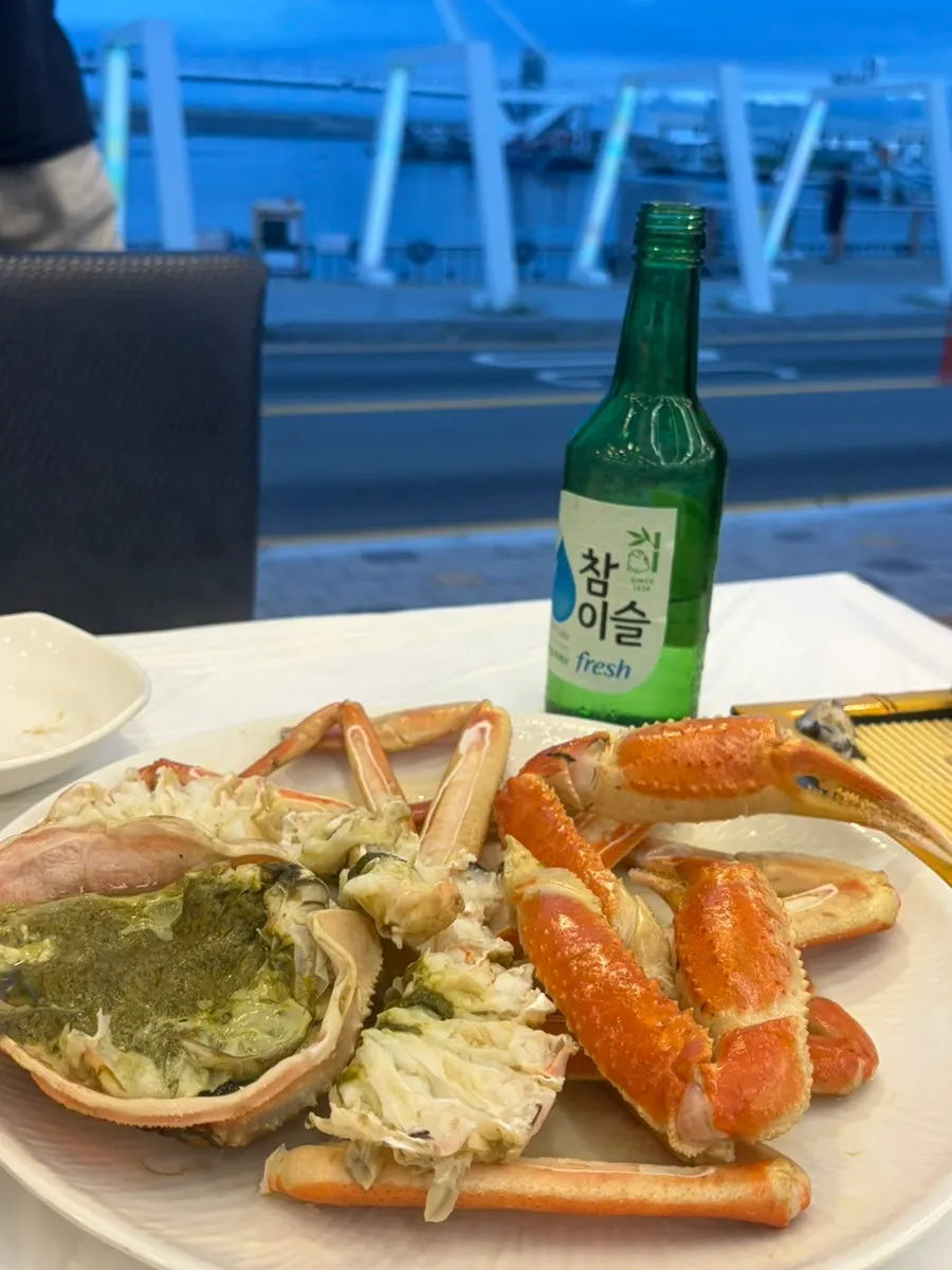 A bite of sashimi wrapped in lettuce