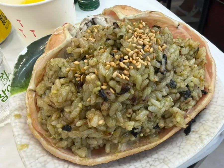 Dipping crab meat into the crab innards