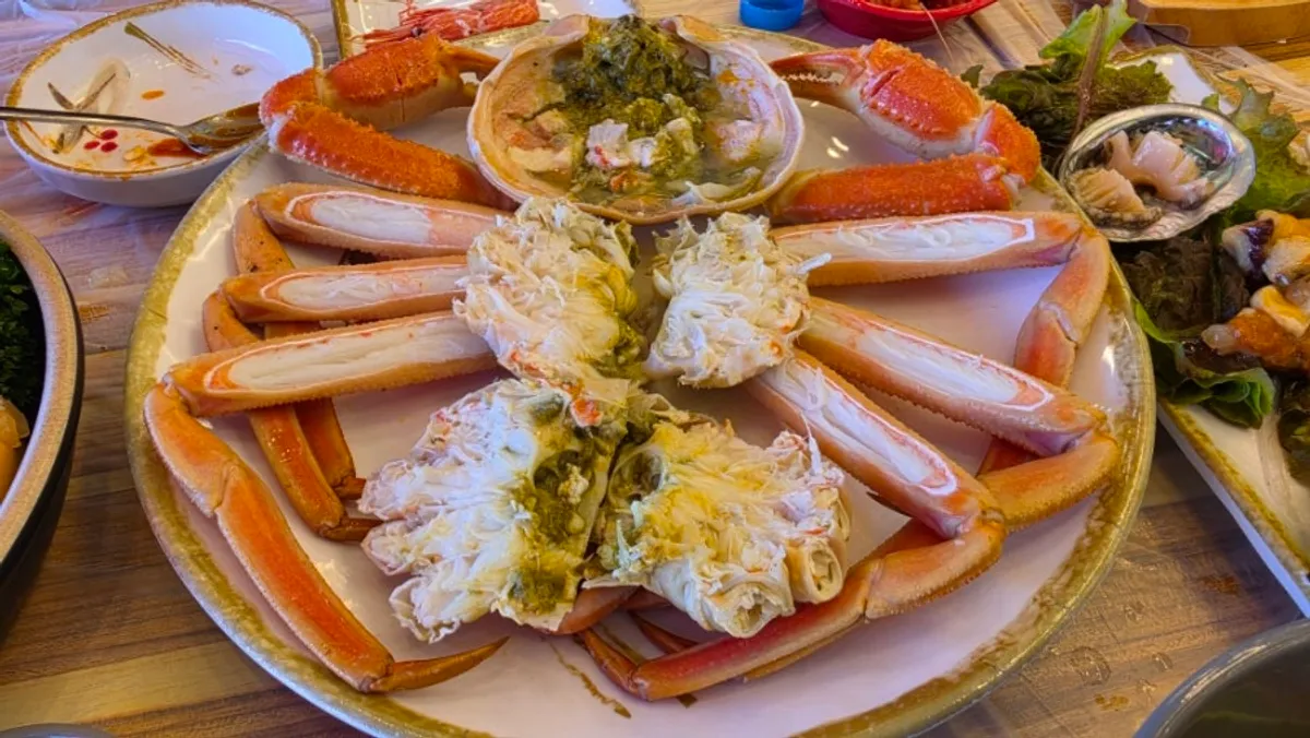 A plate of snow crab with legs prepped and spread out