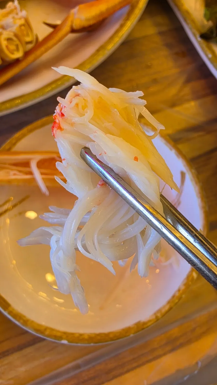 Snow crab leg meat pulled out in one long piece