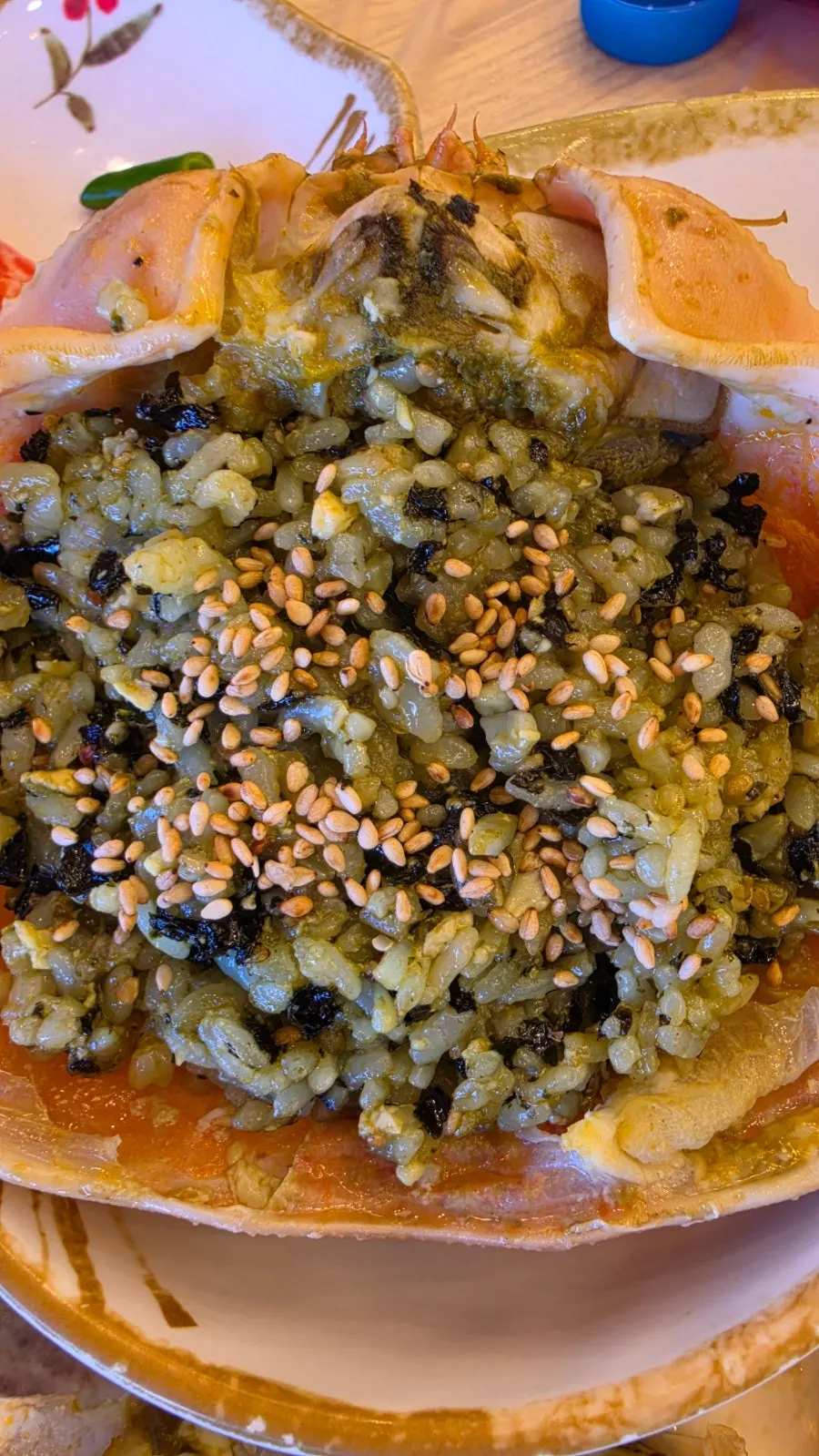 Tomalley fried rice mixed in the crab shell