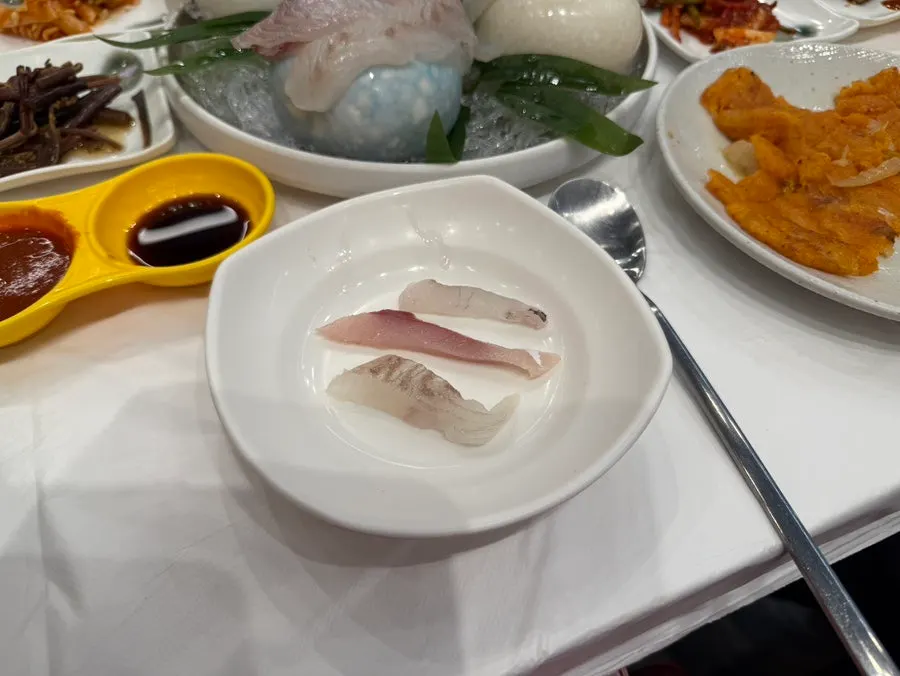 Picking up a piece of sashimi