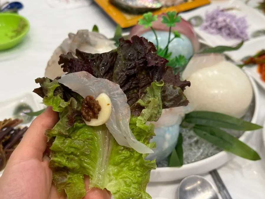 Lettuce wrap topped with special ssamjang and garlic