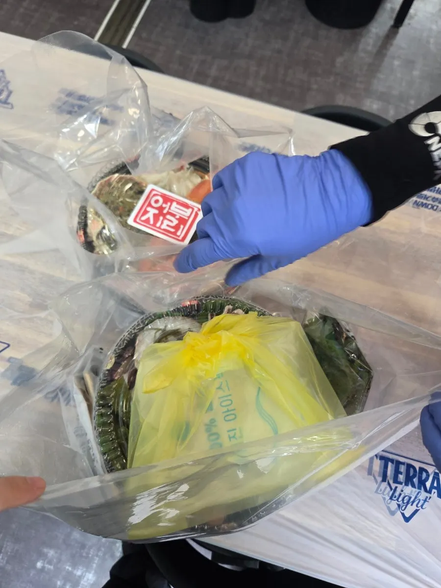 Sashimi and seafood packed with ice packs for takeout