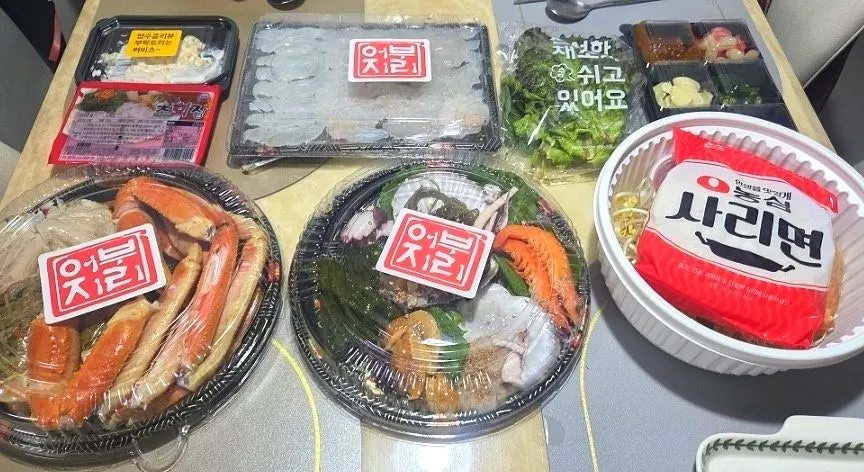 Snow crab and sashimi set laid out at home