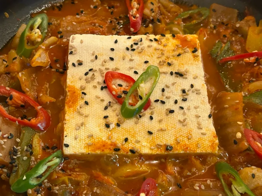 Duruchigi topped with a large block of whole tofu