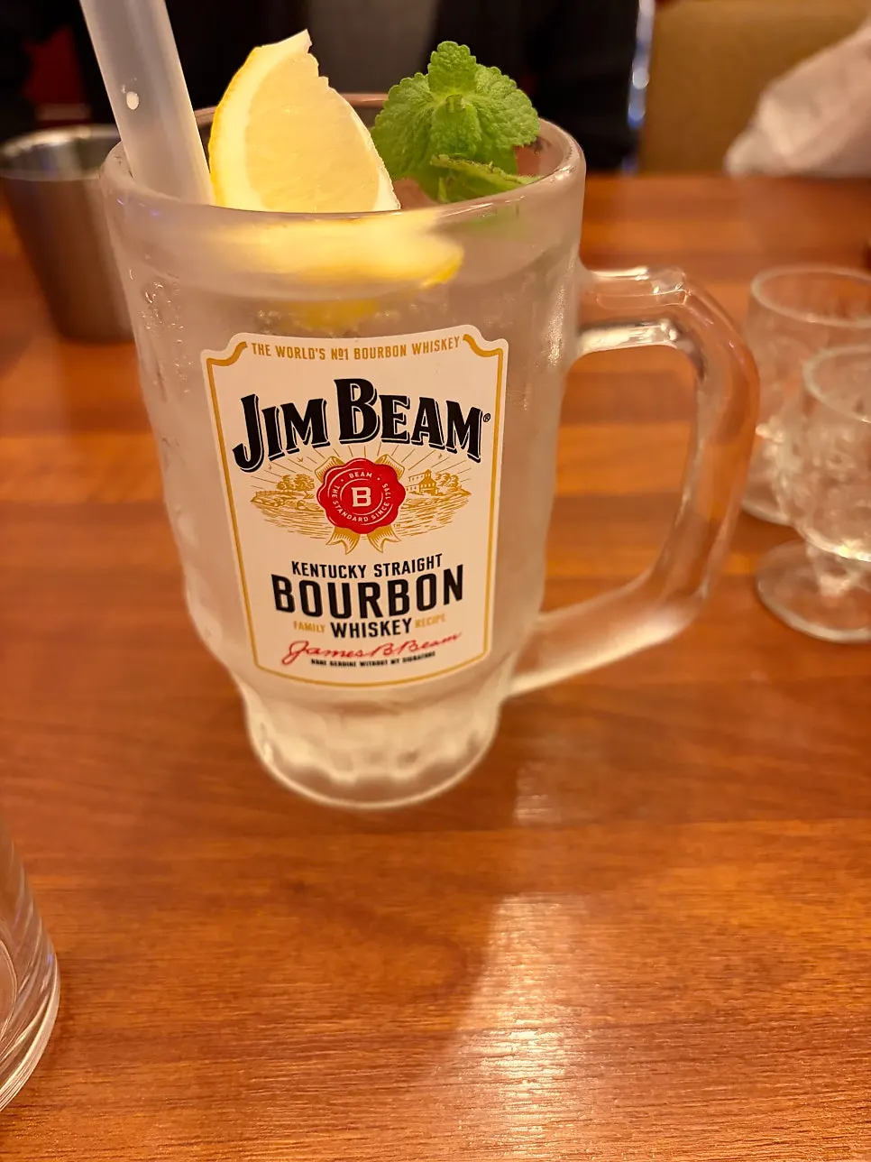 Highball garnished with lemon and herbs