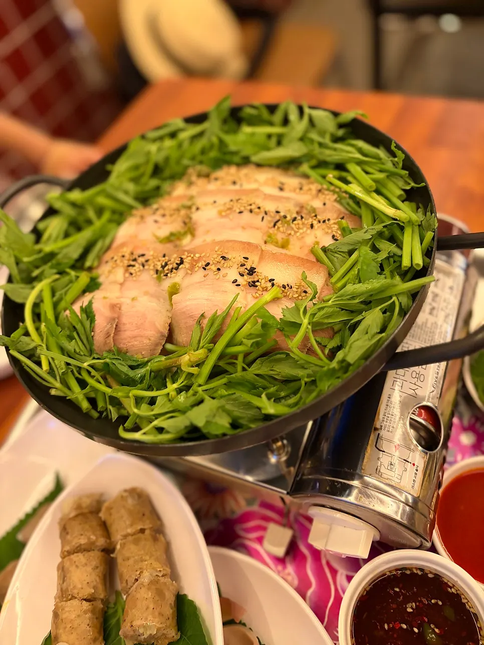 Warm boiled pork topped with minari