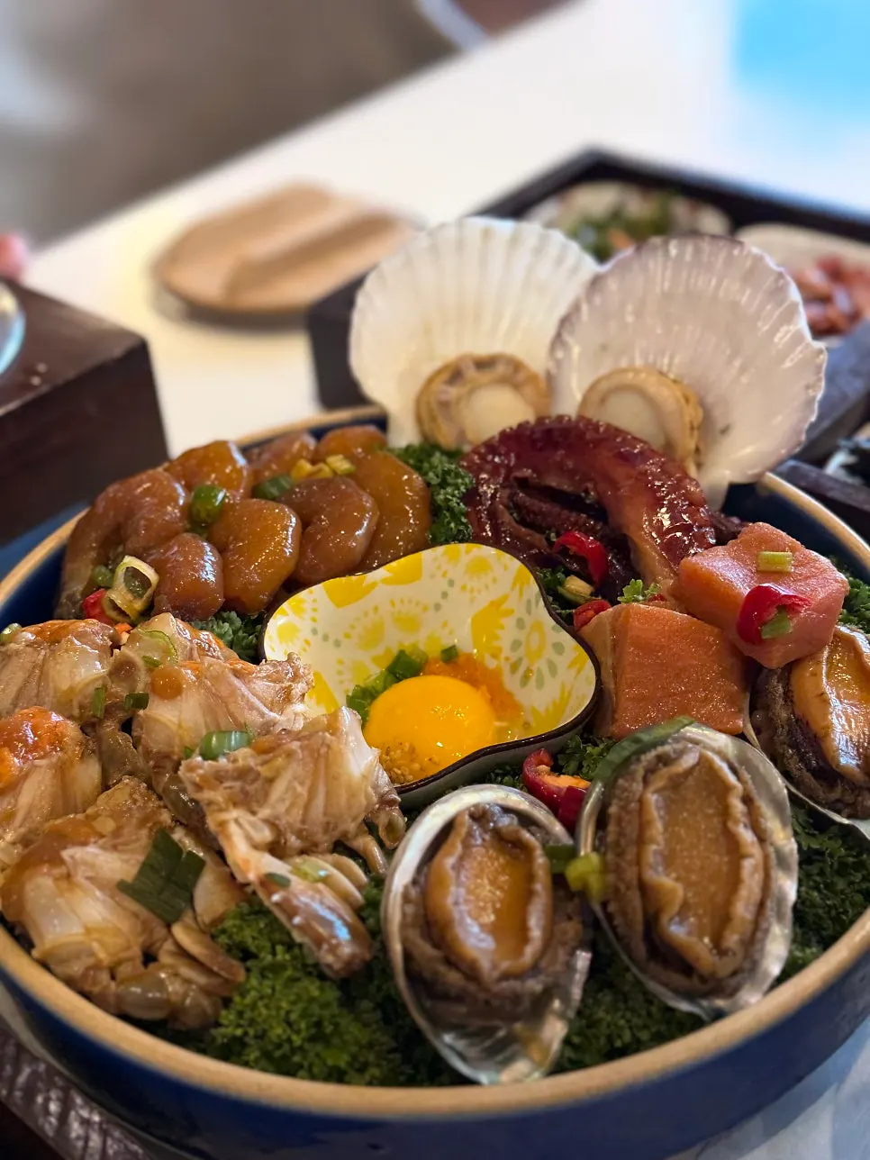 Plate of shrimp and scallop soy sauce marinades among other seafood