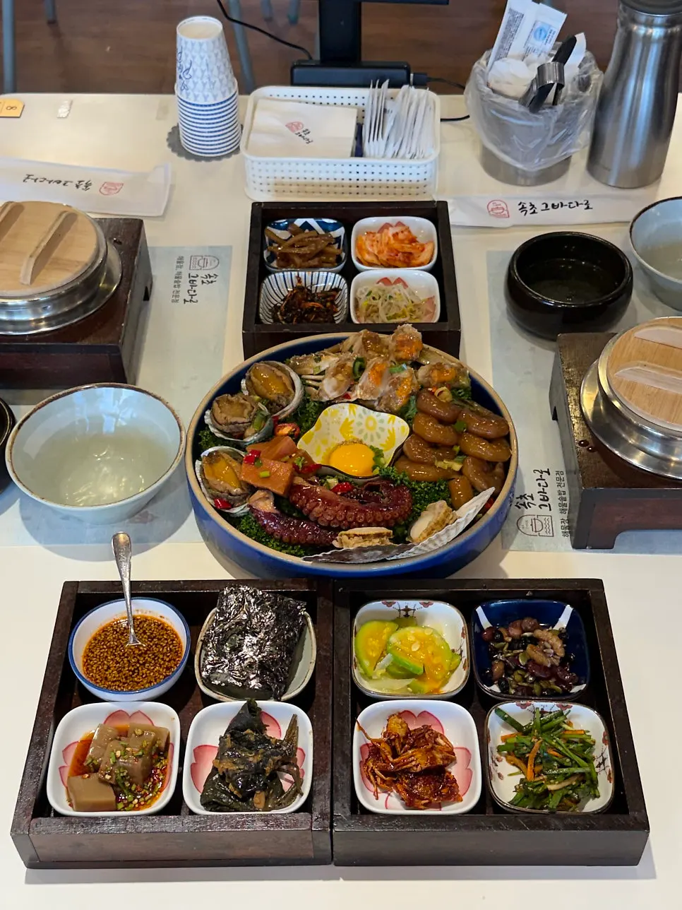 Assorted seafood soy sauce platter with various seafood on top