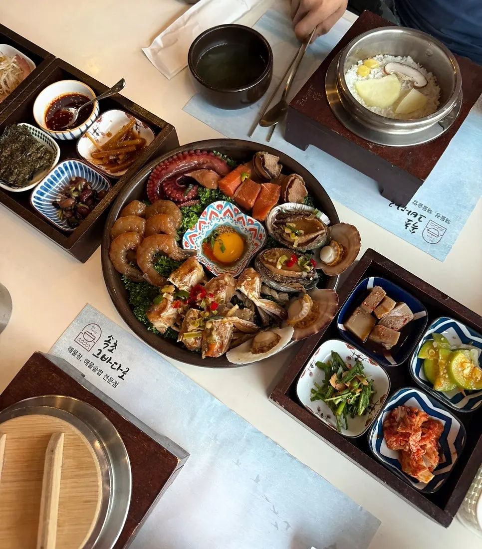 Assorted seafood soy sauce platter with abalone, scallops, and shrimp