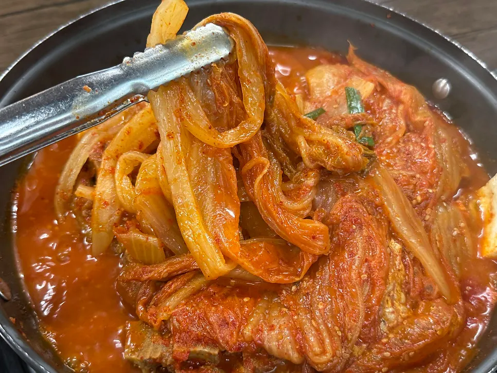 A whole head of well-braised aged kimchi in the pot
