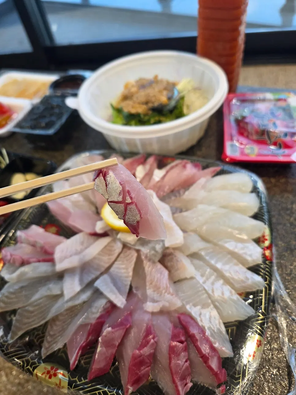 Picking up a piece of sashimi
