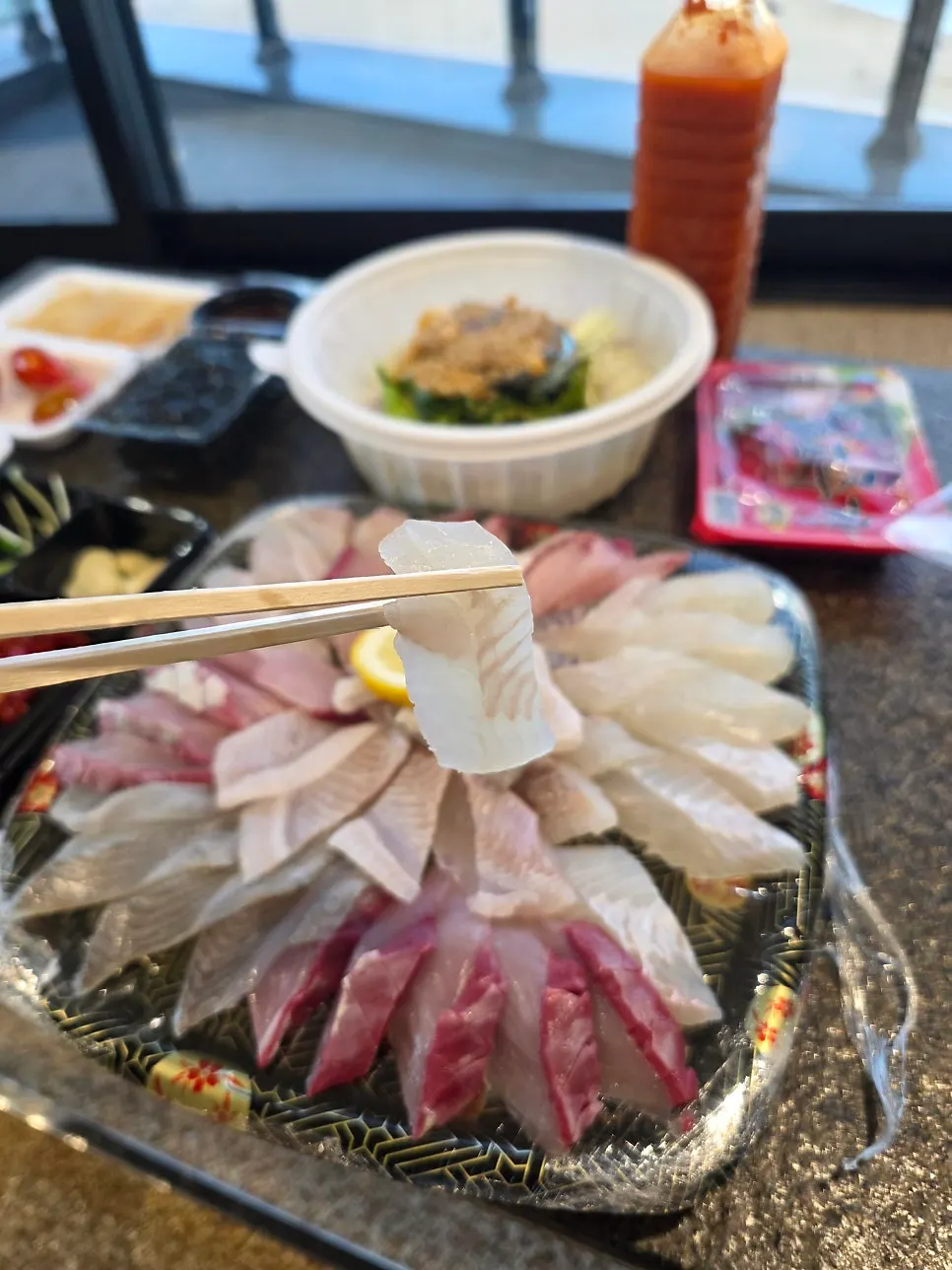 Mixed sashimi eaten with a lettuce wrap