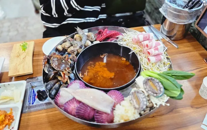 A platter piled generously with seafood for the seafood-bomb shabu