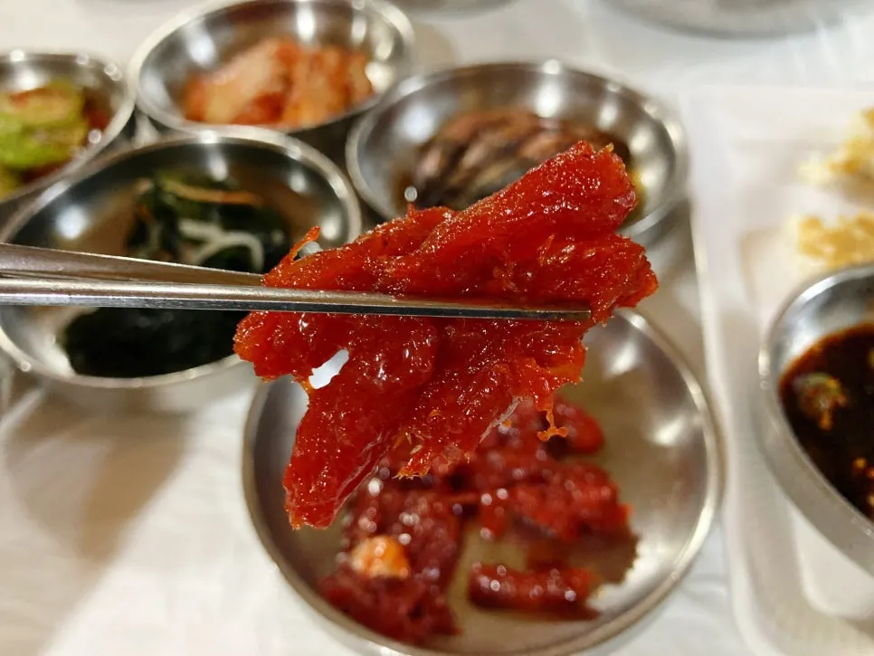 Plates of namul and seaweed salad banchan