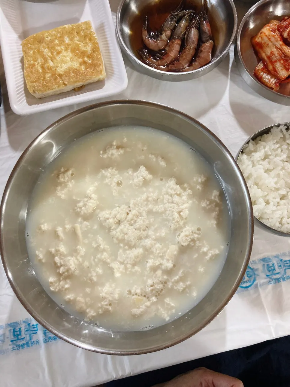 Glossy bowl of rice and side dishes