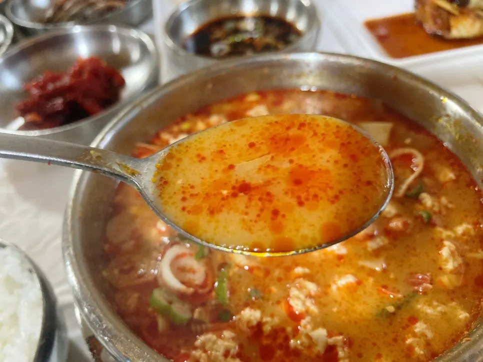 Spicy sundubu served together with rice and banchan