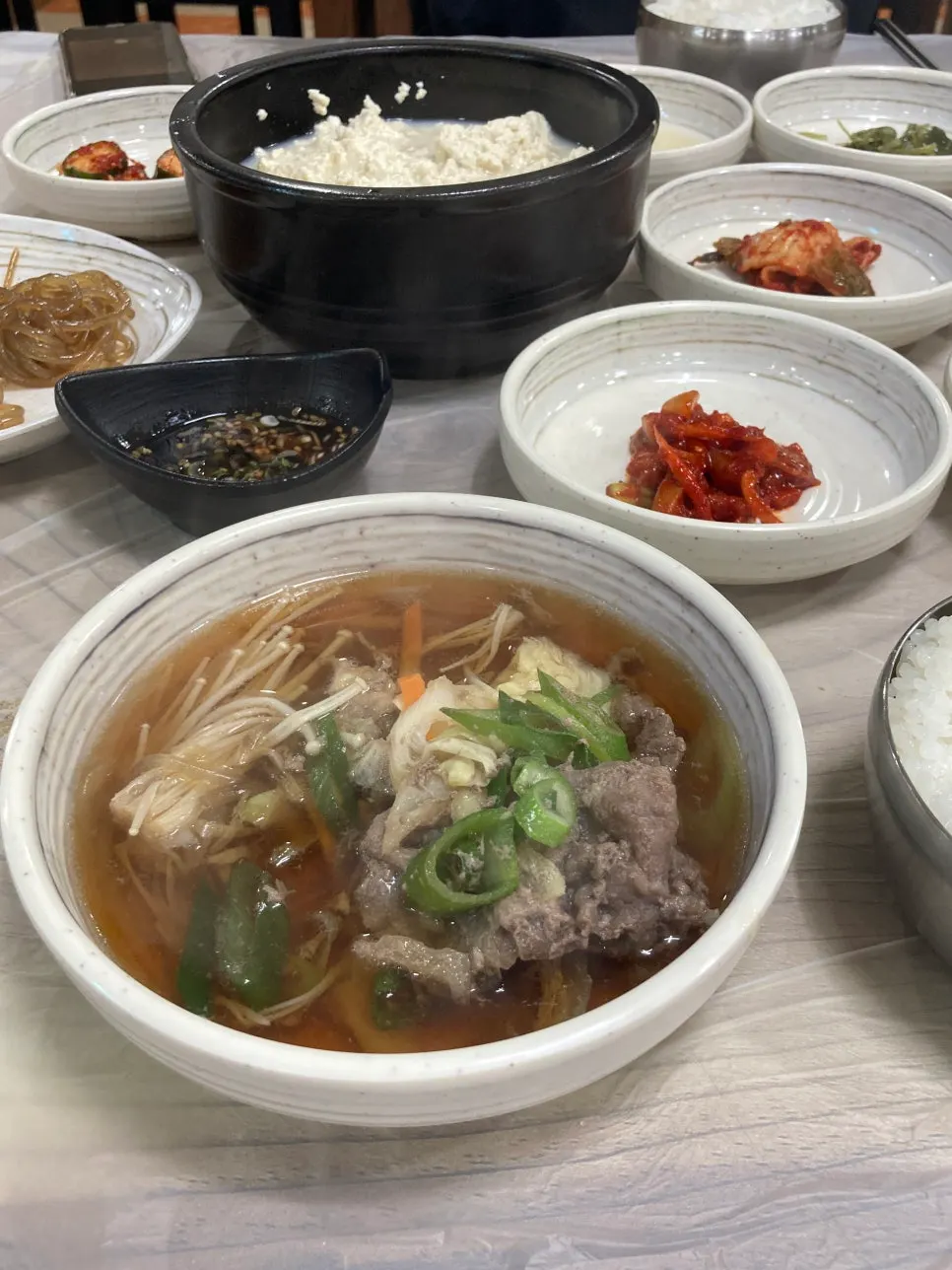Scooping bulgogi to eat with rice