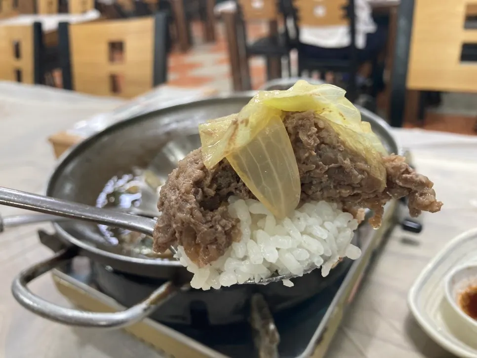 Table set for two with Chodang sundubu and bulgogi baekban
