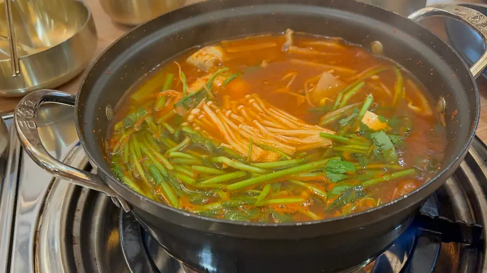 Comparing the two stews at Sokcho Halmae Dongtae-tang
