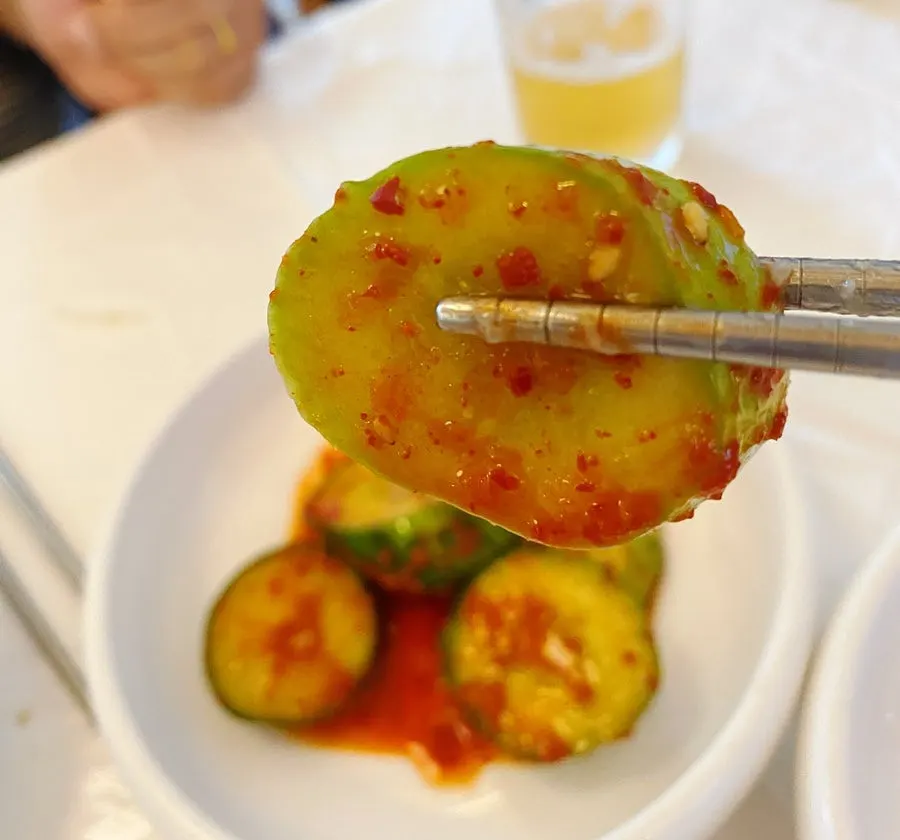 Small bowls of salted anchovy and chili paste condiments
