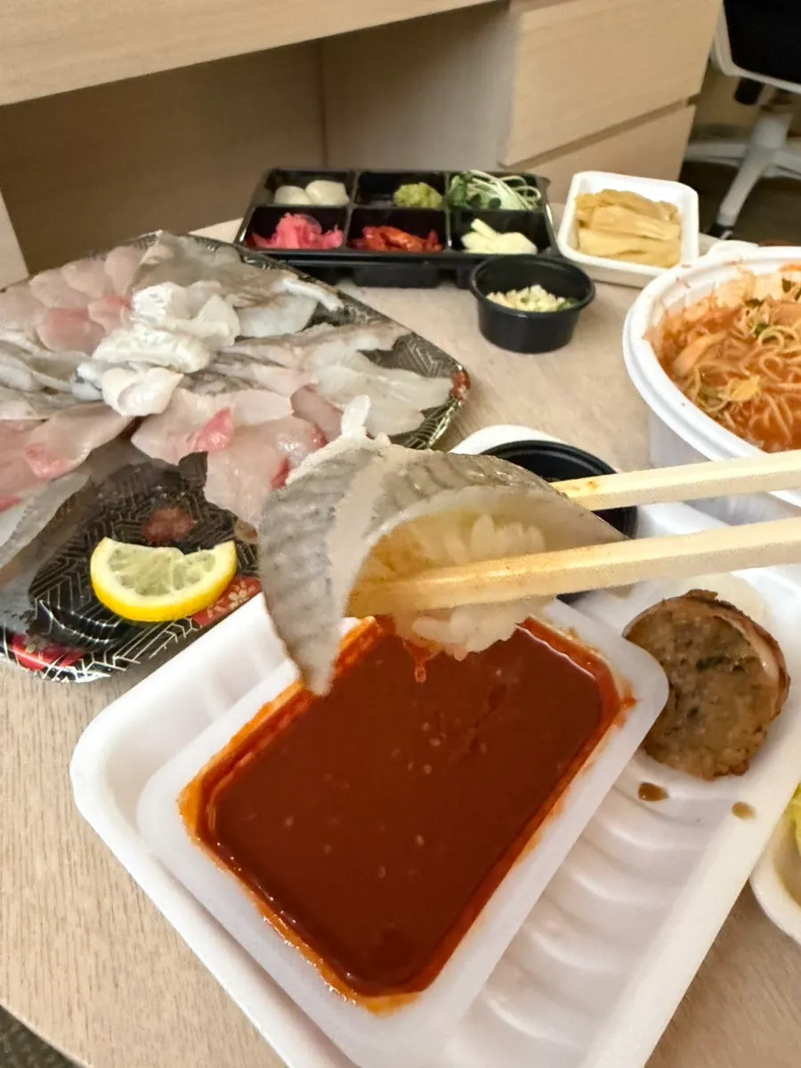 Homemade sashimi sushi with a slice placed on sushi rice