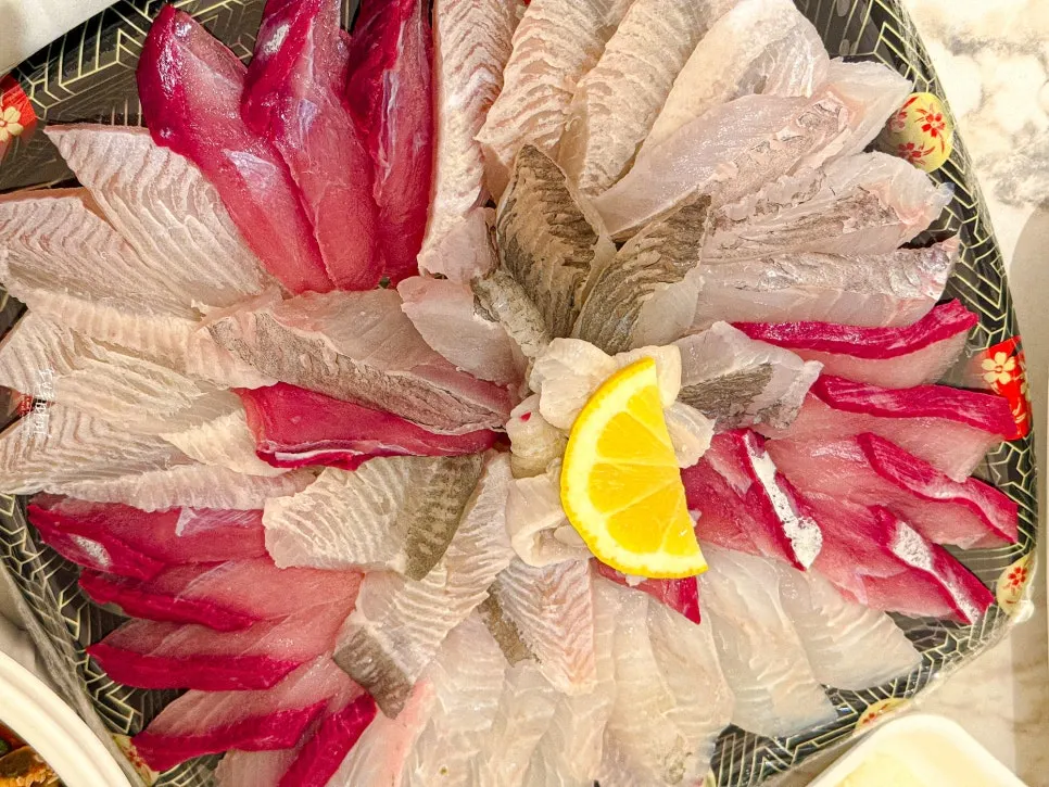 Packed assorted sashimi with flounder, rockfish, and yellowtail