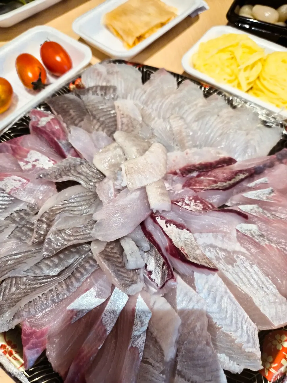 Mixed sashimi and mulhoe set up on the table at the accommodation