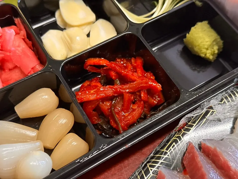 A thick-cut piece of mixed sashimi