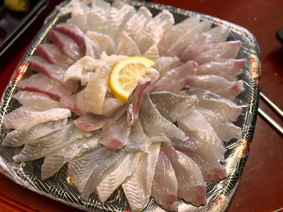 Slowly enjoying the mixed sashimi and mulhoe spread at the hotel