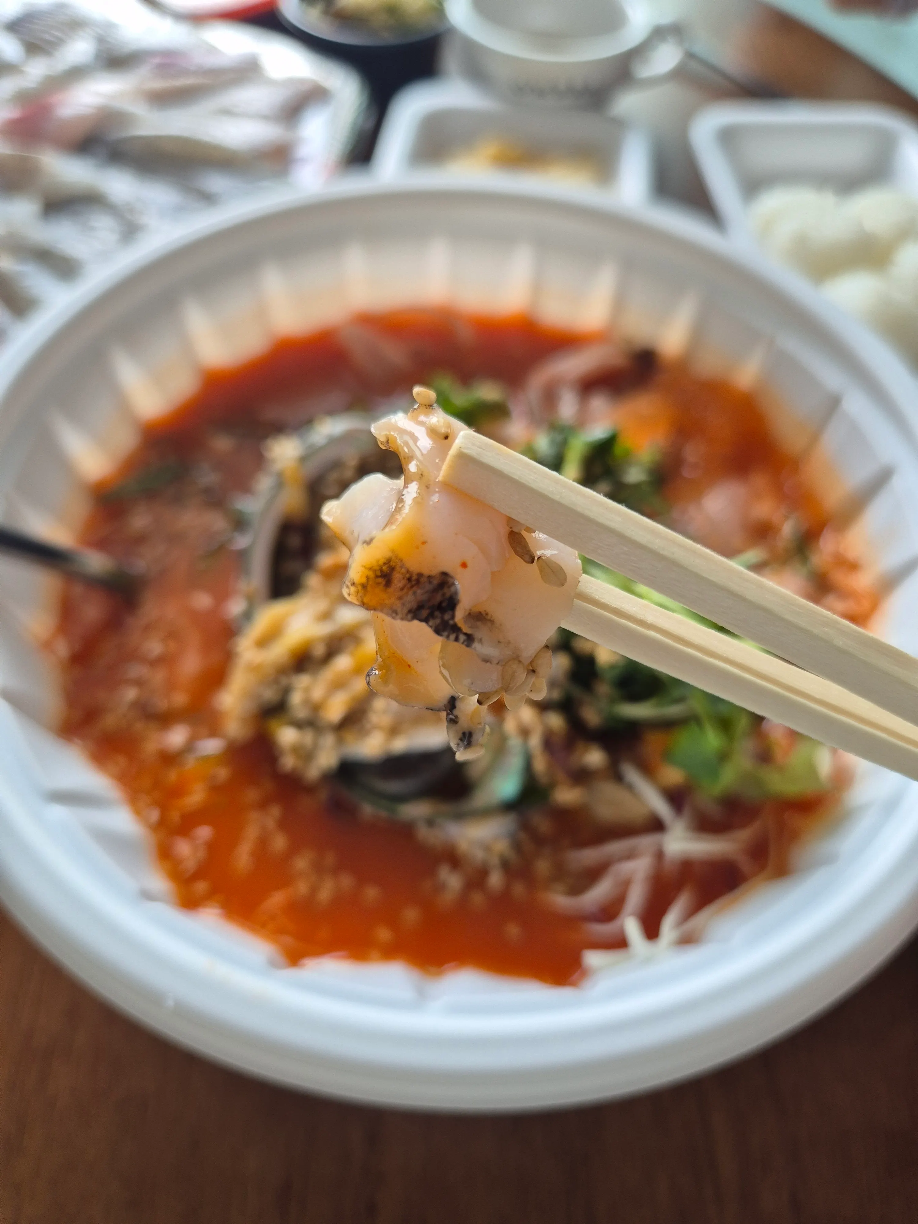 Sokcho mulhoe with iced broth poured from the bottle