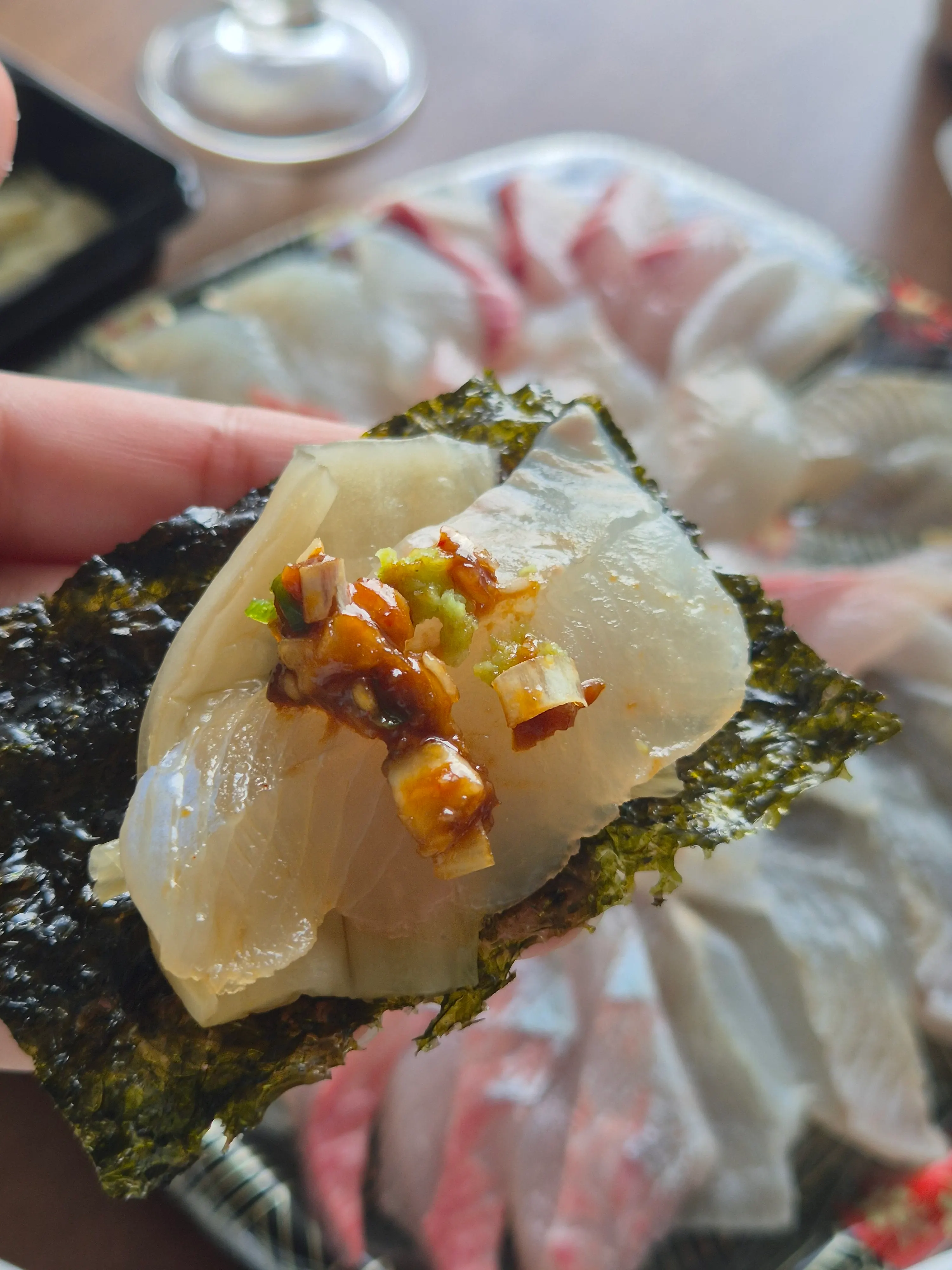 Cold Sokcho mulhoe eaten alongside the mixed sashimi