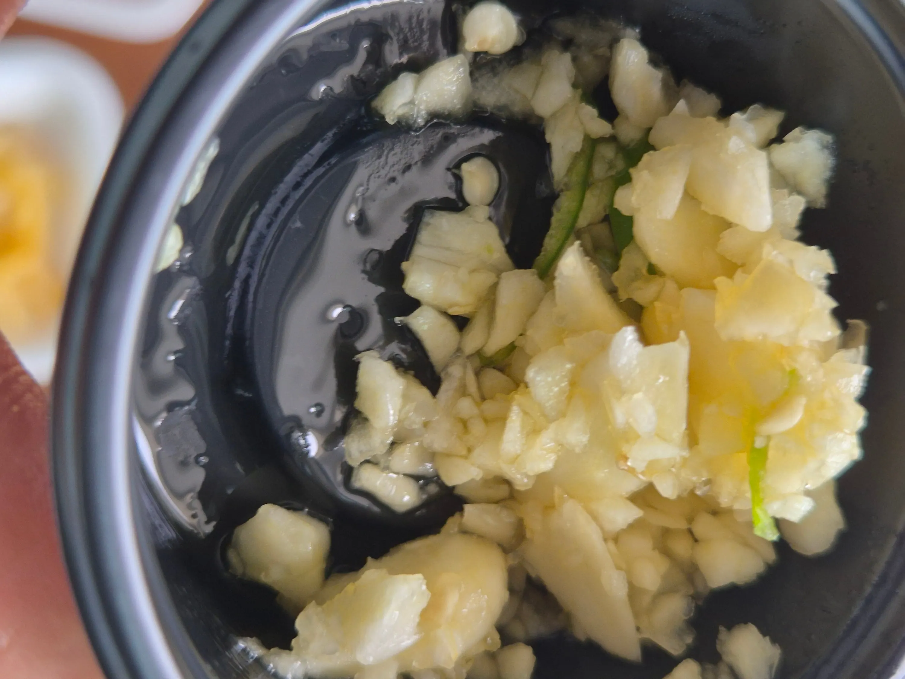 Side dishes and garlic sauce that came with the Hoega takeout order