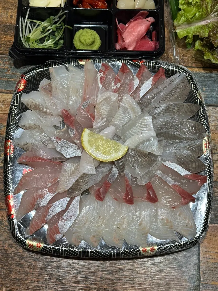 Plate of thickly sliced mixed sashimi from Hoega
