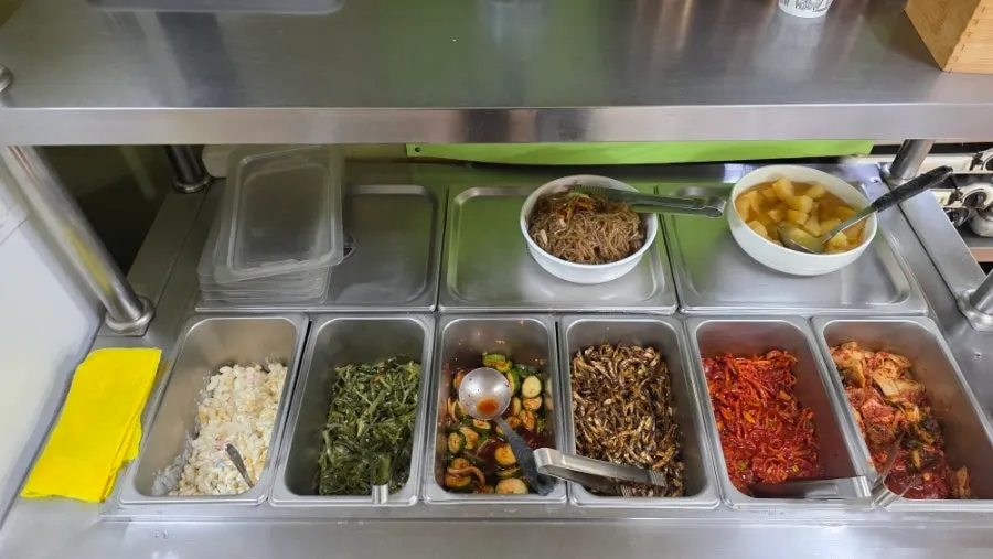 Self-serve bar stocked with side dishes
