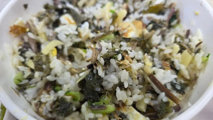 Wild greens bibimbap topped with seasoned greens