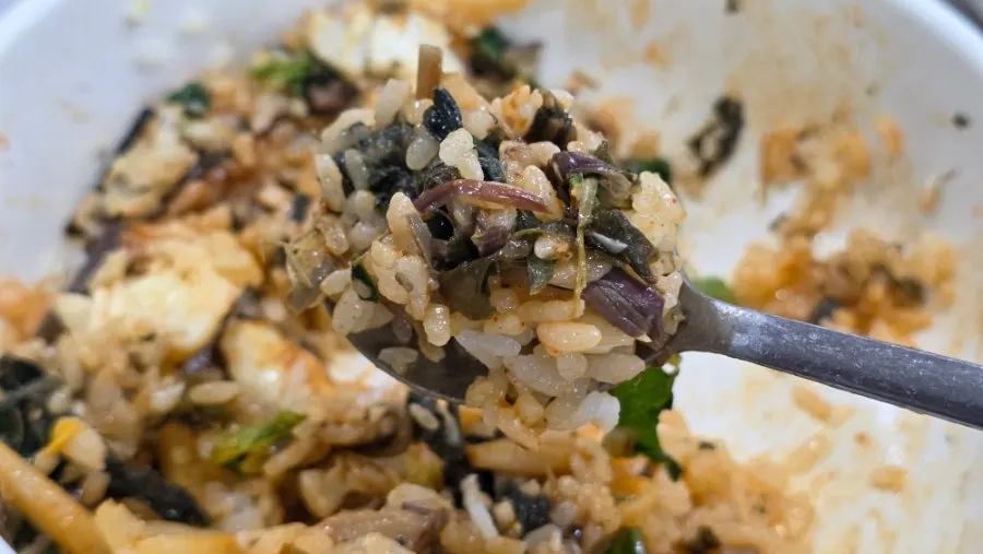 Wild greens bibimbap mixed again with sauce added