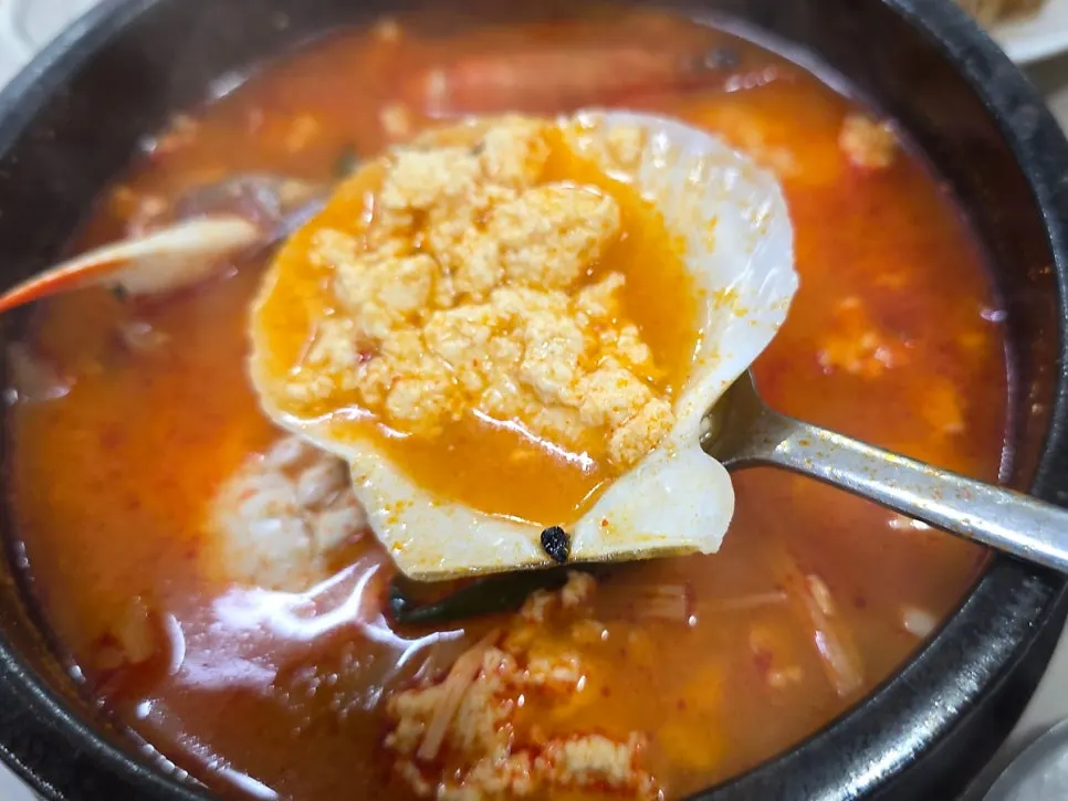 Inside the stone pot with seafood and sundubu