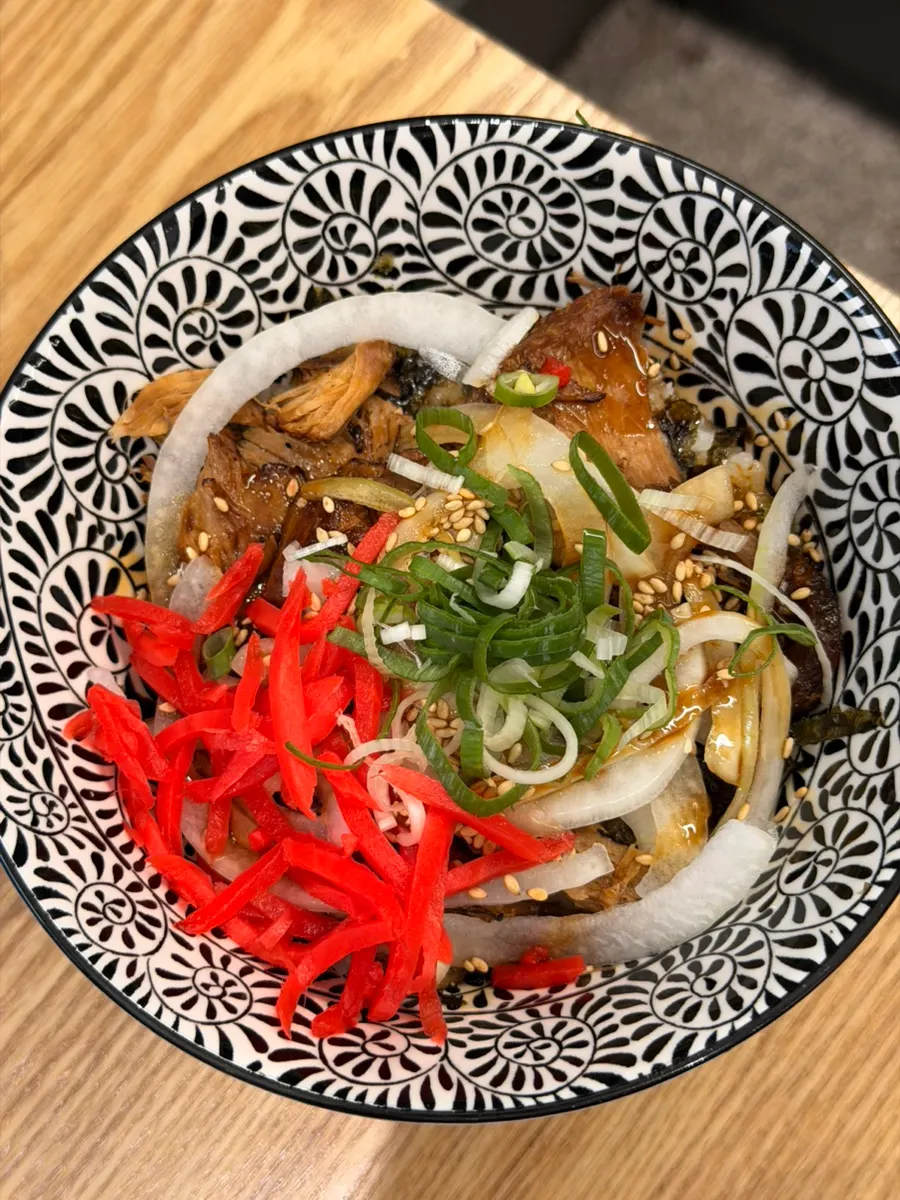 Cold draft beer paired with rich ramen broth