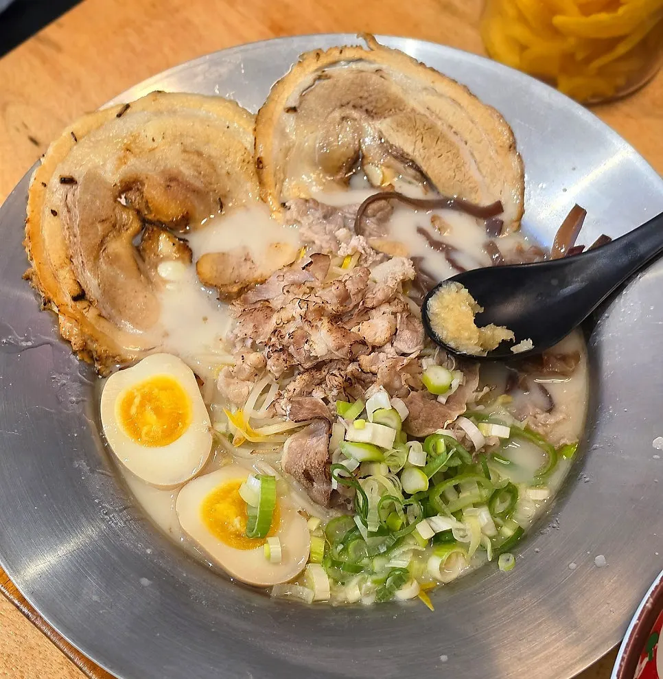 Two bowls of ramen from Ichiba Ramen on the table