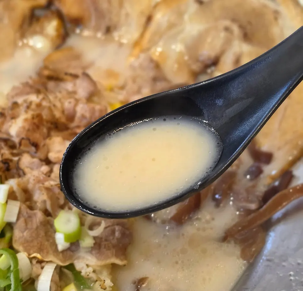 Special tonkotsu ramen topped with rolled pork belly char siu and beef brisket