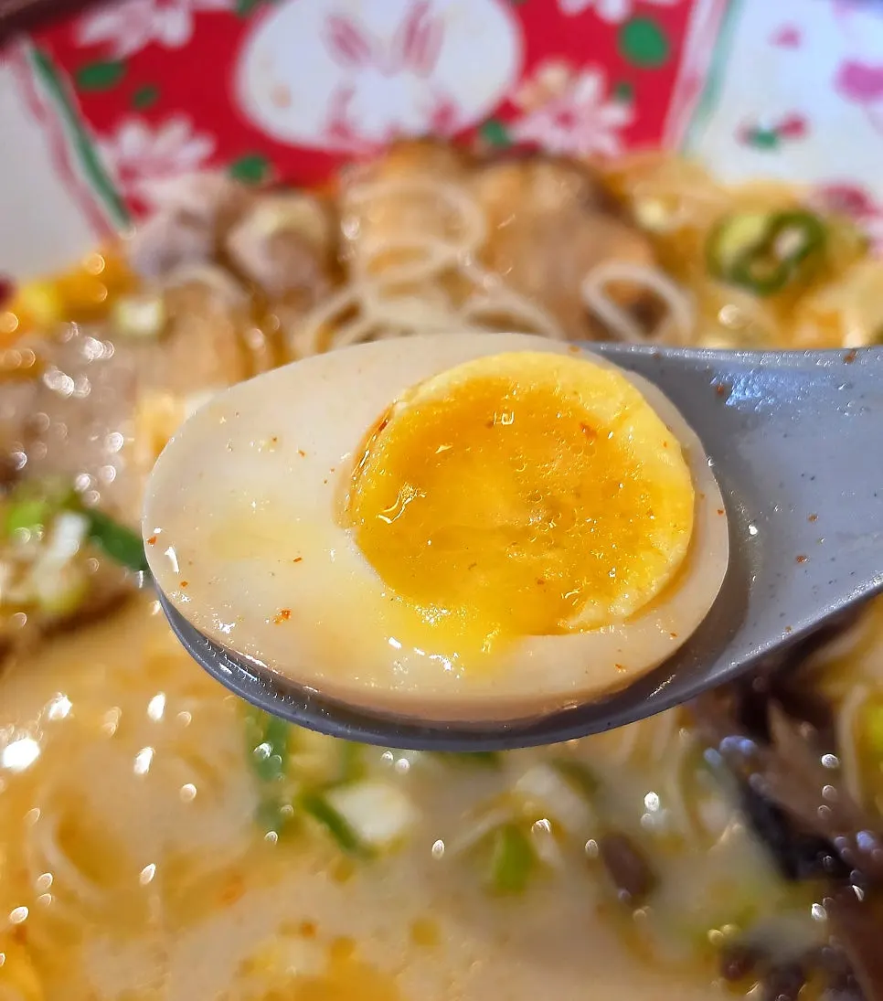 Chewy noodles soaked in karai ramen broth