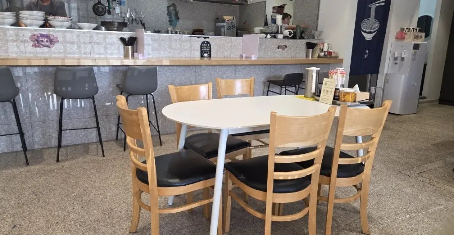 Interior of Ichiba Ramen in white and gray tones
