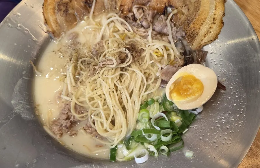 Ramen showing bean sprout and pork toppings