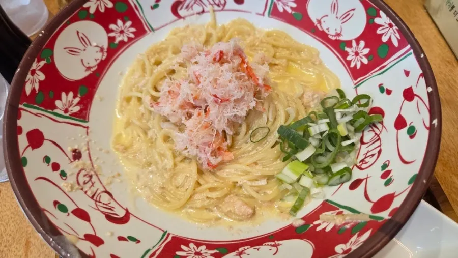 A bowl of red snow crab roe cream ramen